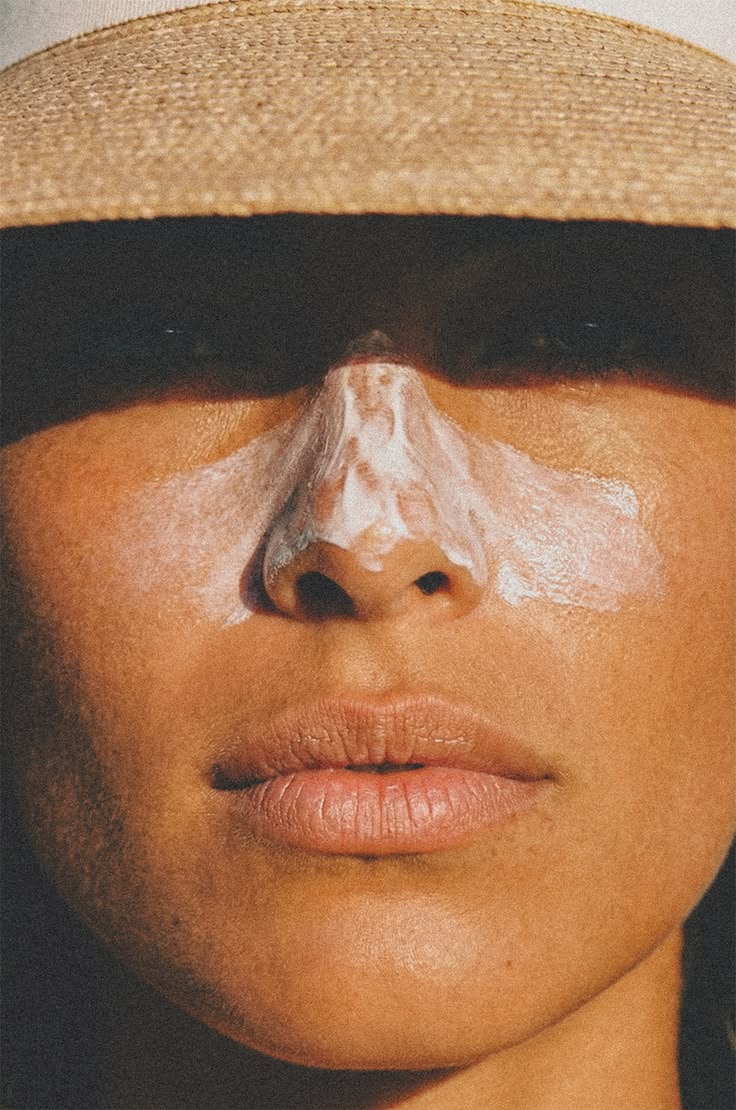 Woman with sunscreen applied on her face. 