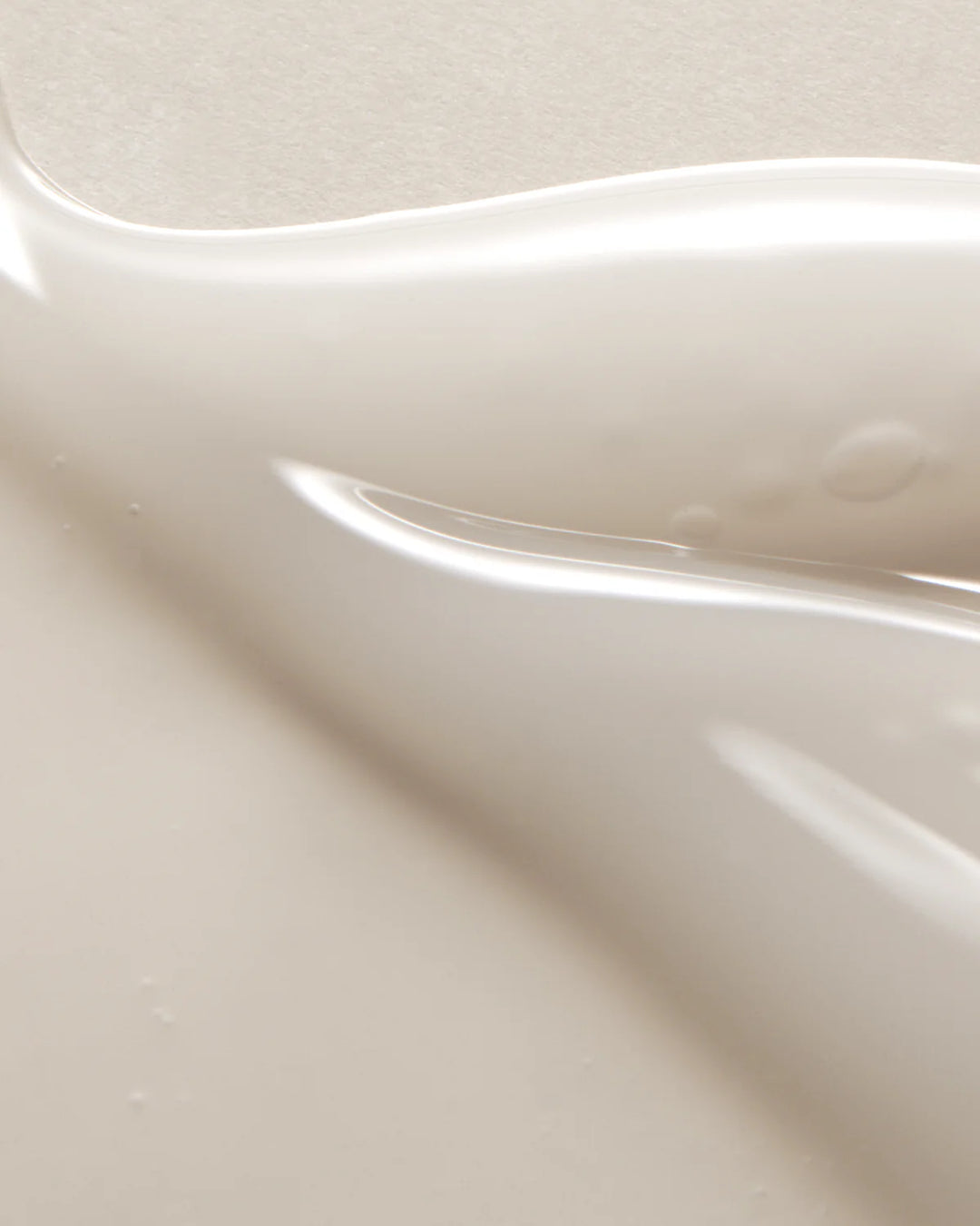 Close up view of the lightweight, hydrating texture of the AXIS-Y Glow Serum