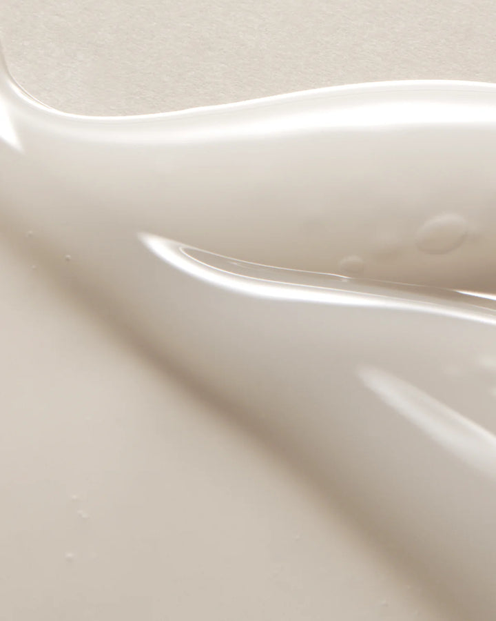 Close up view of the lightweight, hydrating texture of the AXIS-Y Glow Serum