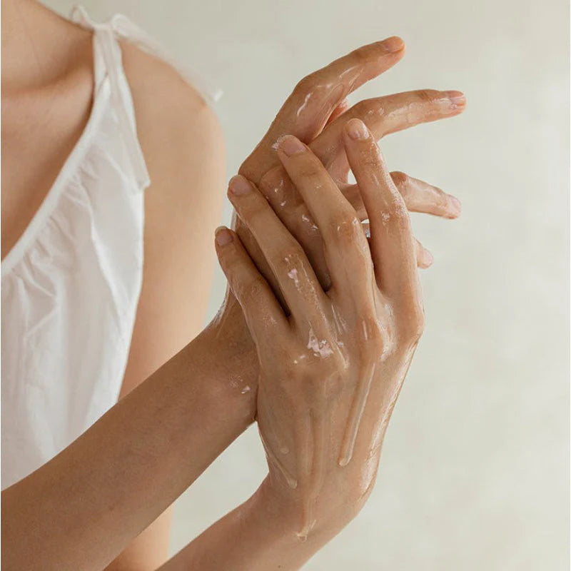 Close up view of the Ginseng Cleansing Oil texture emulsifying with water to remove makeup